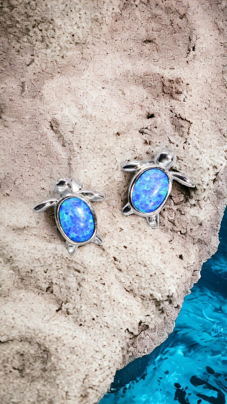 Sterling silver with Cobalt Blue Opal Australian Gemstones placed over an ocean rock